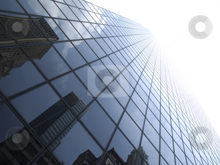 To use this stock image in your creative project, please select the size you need over to the right and click the "Add to Cart" button.
Your downloaded image will come with the Cutcaster watermark removed so don’t worry about the watermark you see on this page. New York building stock photo, High modern skyscrapers on a background of a bright sky and clouds. by Ignacio Gonzalez Prado