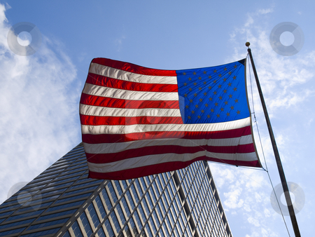 To use this stock image in your creative project, please select the size you need over to the right and click the "Add to Cart" button.
Your downloaded image will come with the Cutcaster watermark removed so don’t worry about the watermark you see on this page. American flag stock photo, American flag waving against a skyscraper and a blue sky. by Ignacio Gonzalez Prado