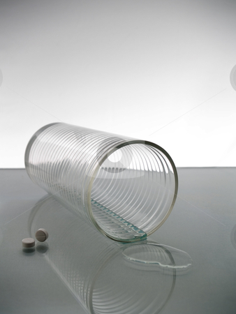 To use this stock image in your creative project, please select the size you need over to the right and click the "Add to Cart" button.
Your downloaded image will come with the Cutcaster watermark removed so don’t worry about the watermark you see on this page. Glass of water stock photo, A felt glass of water with two pills. by Ignacio Gonzalez Prado