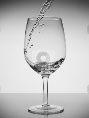 To use this stock image in your creative project, please select the size you need over to the right and click the "Add to Cart" button.
Your downloaded image will come with the Cutcaster watermark removed so don’t worry about the watermark you see on this page. Glass of water stock photo, Water being pored into a glass with reflection on white background. by Ignacio Gonzalez Prado