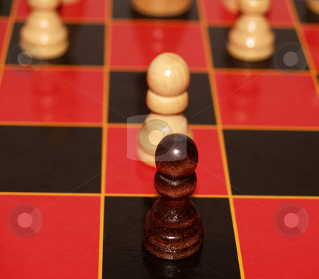 To use this stock image in your creative project, please select the size you need over to the right and click the "Add to Cart" button.
Your downloaded image will come with the Cutcaster watermark removed so don’t worry about the watermark you see on this page. Two Pawns stock photo, Two pawns face off on a red and black chess board by Cora Reed