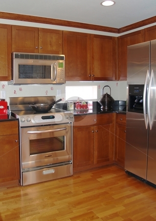 To use this stock image in your creative project, please select the size you need over to the right and click the "Add to Cart" button.
Your downloaded image will come with the Cutcaster watermark removed so don’t worry about the watermark you see on this page. Open kitchen stock photo, Open kitchen with hard wood floors and stainless steal appliances by Cora Reed