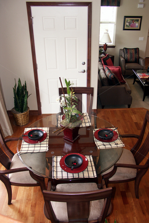 To use this stock image in your creative project, please select the size you need over to the right and click the "Add to Cart" button.
Your downloaded image will come with the Cutcaster watermark removed so don’t worry about the watermark you see on this page. Dinning table stock photo, Dinning area adjacent to the living room by Cora Reed