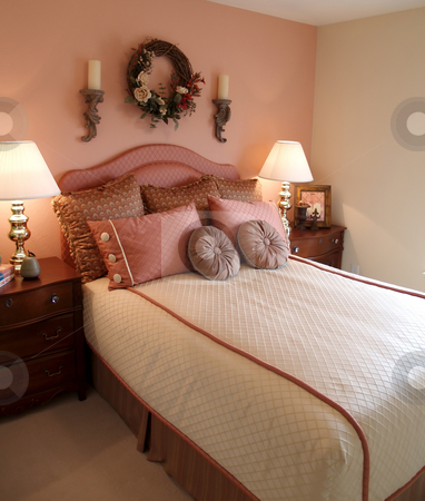 To use this stock image in your creative project, please select the size you need over to the right and click the "Add to Cart" button.
Your downloaded image will come with the Cutcaster watermark removed so don’t worry about the watermark you see on this page. Pink bedroom stock photo, Pretty bedroom in pink with side tables by Cora Reed