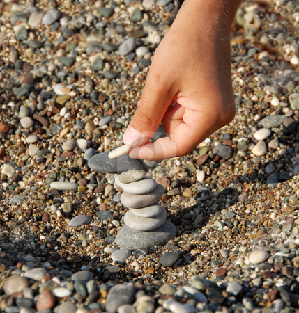 To use this stock image in your creative project, please select the size you need over to the right and click the "Add to Cart" button.
Your downloaded image will come with the Cutcaster watermark removed so don’t worry about the watermark you see on this page. Rocks stack stock photo, Child hands building a rocks stack carefully by Julija Sapic