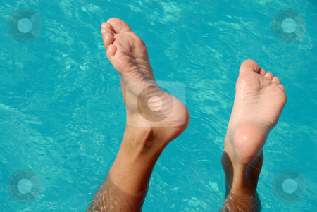 To use this stock image in your creative project, please select the size you need over to the right and click the "Add to Cart" button.
Your downloaded image will come with the Cutcaster watermark removed so don’t worry about the watermark you see on this page. Feet in swimming pool stock photo, Wet boy feet over blue transparent pool water by Julija Sapic