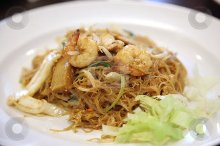 To use this stock image in your creative project, please select the size you need over to the right and click the "Add to Cart" button.
Your downloaded image will come with the Cutcaster watermark removed so don’t worry about the watermark you see on this page. Chinese glass noodles stock photo, Chinese fried glass noodles with prawns traditional cuisine by Kheng Guan Toh