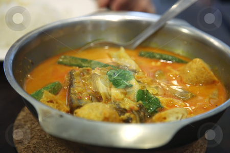 To use this stock image in your creative project, please select the size you need over to the right and click the "Add to Cart" button.
Your downloaded image will come with the Cutcaster watermark removed so don’t worry about the watermark you see on this page. Asian fish curry stock photo, Traditional asian spicy fish curry in metal bowl by Kheng Guan Toh