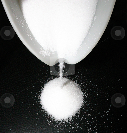To use this stock image in your creative project, please select the size you need over to the right and click the "Add to Cart" button.
Your downloaded image will come with the Cutcaster watermark removed so don’t worry about the watermark you see on this page. Sugar runs out of a bowl stock photo, White grains on dark leather ... by Reinhart Eo