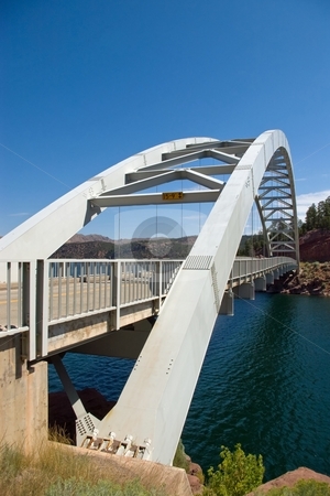 To use this stock image in your creative project, please select the size you need over to the right and click the "Add to Cart" button.
Your downloaded image will come with the Cutcaster watermark removed so don’t worry about the watermark you see on this page. Highway Bridge stock photo, An arched highway bridge spanning a small lake. by Andrew Orlemann
