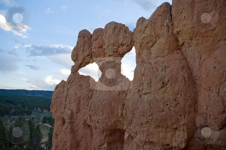 To use this stock image in your creative project, please select the size you need over to the right and click the "Add to Cart" button.
Your downloaded image will come with the Cutcaster watermark removed so don’t worry about the watermark you see on this page. Keyholes stock photo, A wall of pink sandstone with two openings. by Andrew Orlemann