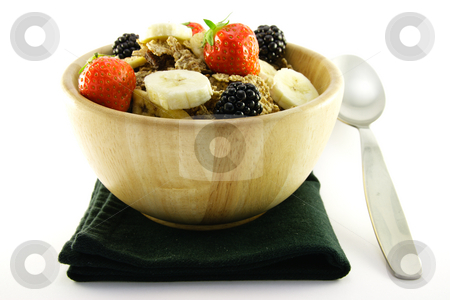 To use this stock image in your creative project, please select the size you need over to the right and click the "Add to Cart" button.
Your downloaded image will come with the Cutcaster watermark removed so don’t worry about the watermark you see on this page. Bran Flakes in a Woodden Bowl stock photo, Crunchy delicious looking bran flakes and juicy fruit in a wooden bowl with a spoon and a black napkin on a white background by Keith Wilson