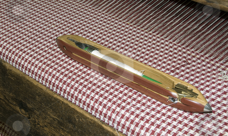 To use this stock image in your creative project, please select the size you need over to the right and click the "Add to Cart" button.
Your downloaded image will come with the Cutcaster watermark removed so don’t worry about the watermark you see on this page. Loom stock photo, The cotton on the big loom to make textile by Chris Willemsen
