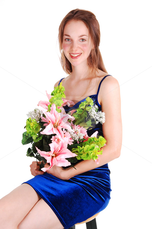 To use this stock image in your creative project, please select the size you need over to the right and click the "Add to Cart" button.
Your downloaded image will come with the Cutcaster watermark removed so don’t worry about the watermark you see on this page. Woman sitting on bar chair. stock photo, Lovely young woman in an royale blue velvet dress sitting on a bar chair and
holding a bunch pink lillys in her arms, with long brown hair. Over white. by Horst Petzold