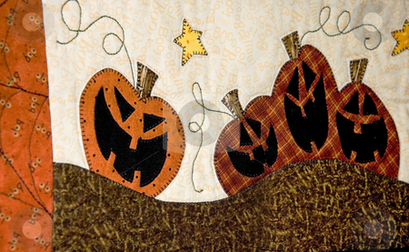 To use this stock image in your creative project, please select the size you need over to the right and click the "Add to Cart" button.
Your downloaded image will come with the Cutcaster watermark removed so don’t worry about the watermark you see on this page. Fall Jack O Lantern Fabric Design stock photo, This fall theme jack o lantern design is an abstract pattern on fabric for rich texture and color. by Valerie Garner
