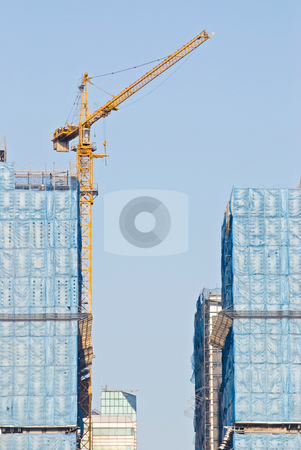 To use this stock image in your creative project, please select the size you need over to the right and click the "Add to Cart" button.
Your downloaded image will come with the Cutcaster watermark removed so don’t worry about the watermark you see on this page. Hoist and under construction Buildings stock photo, Hoist and under construction Buildings by Lawren