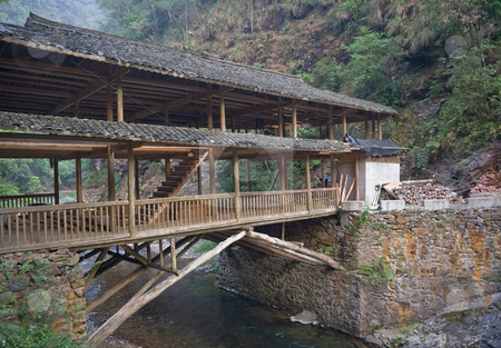 To use this stock image in your creative project, please select the size you need over to the right and click the "Add to Cart" button.
Your downloaded image will come with the Cutcaster watermark removed so don’t worry about the watermark you see on this page. Wodden bridge in China stock photo, Southern China near Guilin wodden bridge over the mountain river by Marek Poplawski