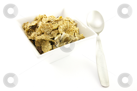 To use this stock image in your creative project, please select the size you need over to the right and click the "Add to Cart" button.
Your downloaded image will come with the Cutcaster watermark removed so don’t worry about the watermark you see on this page. Bran Flakes in a White Bowl stock photo, Crunchy delicious looking bran flakes in a white bowl with a spoon on a white background by Keith Wilson