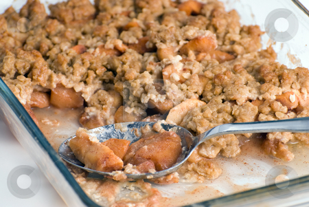 To use this stock image in your creative project, please select the size you need over to the right and click the "Add to Cart" button.
Your downloaded image will come with the Cutcaster watermark removed so don’t worry about the watermark you see on this page. Apple Crisp stock photo, Closeup view of a spoon sitting in a glass dish containing apple crisp by Richard Nelson
