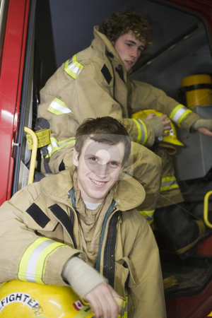 To use this stock image in your creative project, please select the size you need over to the right and click the "Add to Cart" button.
Your downloaded image will come with the Cutcaster watermark removed so don’t worry about the watermark you see on this page. Two young Firemen stock photo, Waiting for the debriefing by Sharron Schiefelbein