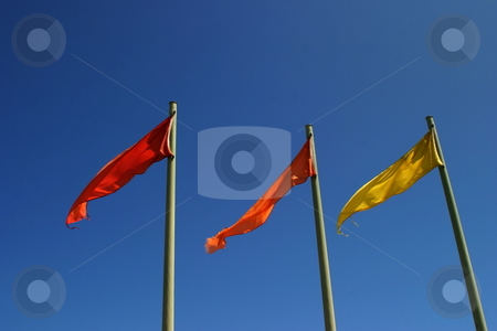 To use this stock image in your creative project, please select the size you need over to the right and click the "Add to Cart" button.
Your downloaded image will come with the Cutcaster watermark removed so don’t worry about the watermark you see on this page. Color Flags stock photo, Three red, orange and yellow flag with blue sky in the background by Henrik Lehnerer