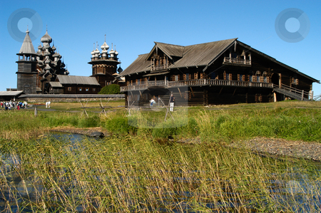 To use this stock image in your creative project, please select the size you need over to the right and click the "Add to Cart" button.
Your downloaded image will come with the Cutcaster watermark removed so don’t worry about the watermark you see on this page. Kizhi stock photo, Russia, Karelia Republic, Lake Onega, Kizhi Island, Kizhi Open Air Museum, A traditional home for a large family (Transfiguration Church, Bell Tower, & Intercession Church in b.g.) by David Ryan