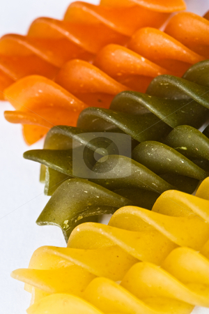 To use this stock image in your creative project, please select the size you need over to the right and click the "Add to Cart" button.
Your downloaded image will come with the Cutcaster watermark removed so don’t worry about the watermark you see on this page. Pasta stock photo, Macro of colored raw fusilli or rotini pasta in studio by Jose Wilson Araujo