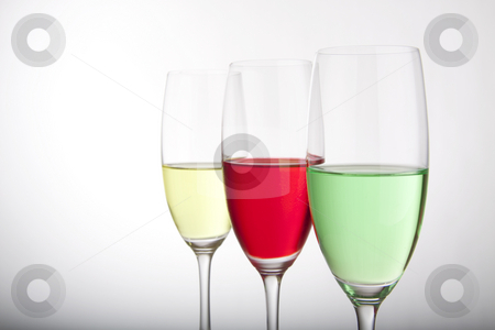 To use this stock image in your creative project, please select the size you need over to the right and click the "Add to Cart" button.
Your downloaded image will come with the Cutcaster watermark removed so don’t worry about the watermark you see on this page. Row of three colorful cocktails stock photo, Colorful cocktails for a party or celebration served in a champagne glass by Daniel Kafer