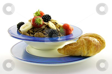 To use this stock image in your creative project, please select the size you need over to the right and click the "Add to Cart" button.
Your downloaded image will come with the Cutcaster watermark removed so don’t worry about the watermark you see on this page. Bran Flakes in a Blue Bowl stock photo, Crunchy looking delicious bran flakes and juicy fruit in a blue bowl with a croissant on a white background by Keith Wilson