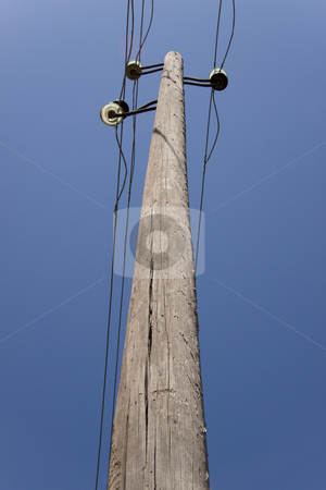 To use this stock image in your creative project, please select the size you need over to the right and click the "Add to Cart" button.
Your downloaded image will come with the Cutcaster watermark removed so don’t worry about the watermark you see on this page. Wooden pillar stock photo, Old one wooden pillar with power line, blue sky. by Tomasz Parys