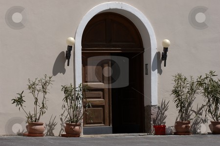 To use this stock image in your creative project, please select the size you need over to the right and click the "Add to Cart" button.
Your downloaded image will come with the Cutcaster watermark removed so don’t worry about the watermark you see on this page. Entrance Door stock photo, Old wooden entrance door awaiting guests, mediterranean style by Andre Janssen
