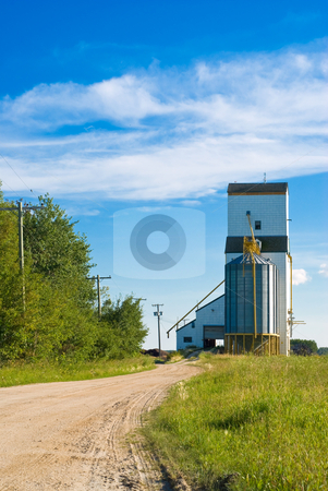 To use this stock image in your creative project, please select the size you need over to the right and click the "Add to Cart" button.
Your downloaded image will come with the Cutcaster watermark removed so don’t worry about the watermark you see on this page. Prairie Grain Elevator stock photo, A prairie grain elevator with a dirt road running to it shot on a partly cloudy day by Richard Nelson