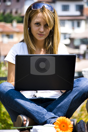 To use this stock image in your creative project, please select the size you need over to the right and click the "Add to Cart" button.
Your downloaded image will come with the Cutcaster watermark removed so don’t worry about the watermark you see on this page. Beautiful young woman with laptop stock photo, Beautiful young woman working out with laptop or notebook by Desislava Dimitrova
