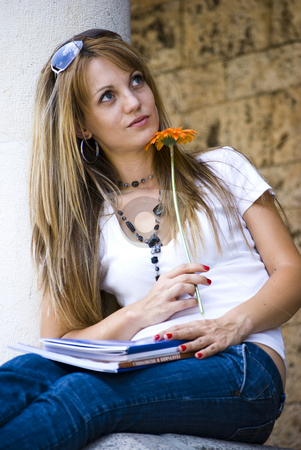 To use this stock image in your creative project, please select the size you need over to the right and click the "Add to Cart" button.
Your downloaded image will come with the Cutcaster watermark removed so don’t worry about the watermark you see on this page. Beautiful young woman with books and flower stock photo, Beautiful young woman with books and flower outdoor by Desislava Dimitrova