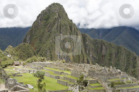 To use this stock image in your creative project, please select the size you need over to the right and click the "Add to Cart" button.
Your downloaded image will come with the Cutcaster watermark removed so don’t worry about the watermark you see on this page. Overview of Machu Picchu Inca ruins Peru stock photo, Overview of Machu Picchu Inca ruins Peru by Sharron Schiefelbein