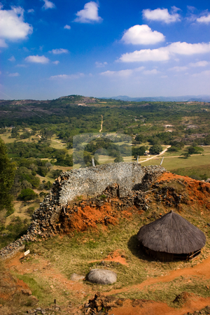 To use this stock image in your creative project, please select the size you need over to the right and click the "Add to Cart" button.
Your downloaded image will come with the Cutcaster watermark removed so don’t worry about the watermark you see on this page. A king's view stock photo, A view of a thatched hut and the protective wall from the king''s enclosure at Great Zimbawe. by Darren Pattterson