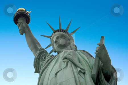 To use this stock image in your creative project, please select the size you need over to the right and click the "Add to Cart" button.
Your downloaded image will come with the Cutcaster watermark removed so don’t worry about the watermark you see on this page. Statue of Liberty stock photo, Statue of liberty with a blue sky background by Darren Pattterson