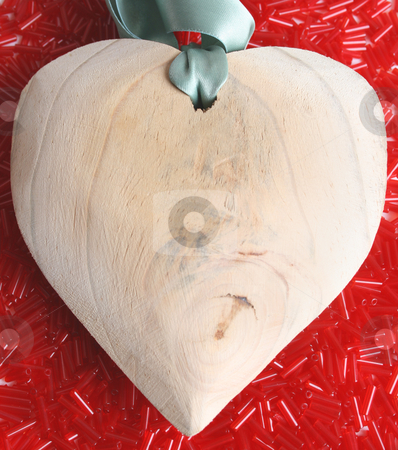To use this stock image in your creative project, please select the size you need over to the right and click the "Add to Cart" button.
Your downloaded image will come with the Cutcaster watermark removed so don’t worry about the watermark you see on this page. Heart stock photo, Large wooden heart on a bed of red beads by Vanessa Van Rensburg
