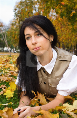 To use this stock image in your creative project, please select the size you need over to the right and click the "Add to Cart" button.
Your downloaded image will come with the Cutcaster watermark removed so don’t worry about the watermark you see on this page. Brunette girl and golden leaves stock photo, Pretty brunette girl resting in an autumn park by Mikhail Lavrenov