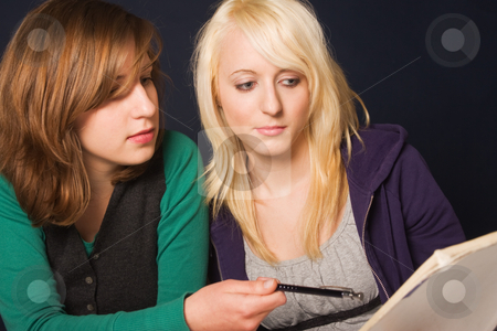 To use this stock image in your creative project, please select the size you need over to the right and click the "Add to Cart" button.
Your downloaded image will come with the Cutcaster watermark removed so don’t worry about the watermark you see on this page. Students at homework stock photo, Two girls doing their homework together by Mikhail Lavrenov