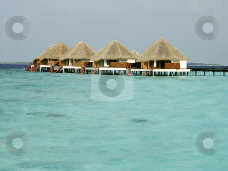 To use this stock image in your creative project, please select the size you need over to the right and click the "Add to Cart" button.
Your downloaded image will come with the Cutcaster watermark removed so don’t worry about the watermark you see on this page. Tropical beach and Cabanas on Maldives Island stock photo, Tropical beach and Cabanas on Maldives Island by Sharron Schiefelbein
