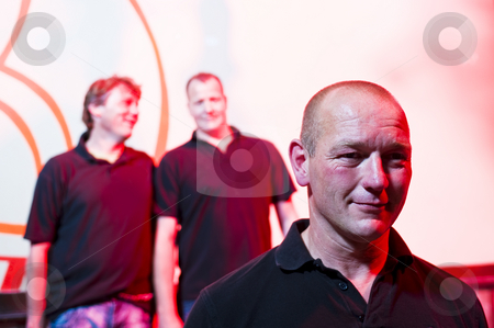 To use this stock image in your creative project, please select the size you need over to the right and click the "Add to Cart" button.
Your downloaded image will come with the Cutcaster watermark removed so don’t worry about the watermark you see on this page. Portrait of a man stock photo, Portrait of a mid adult man, with two of his friends in the background by Corepics VOF
