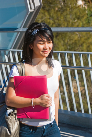 To use this stock image in your creative project, please select the size you need over to the right and click the "Add to Cart" button.
Your downloaded image will come with the Cutcaster watermark removed so don’t worry about the watermark you see on this page. Smiling student stock photo, Young smiling Asian student holding a pink folder and wearing a tiara by Corepics VOF