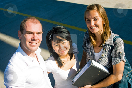 To use this stock image in your creative project, please select the size you need over to the right and click the "Add to Cart" button.
Your downloaded image will come with the Cutcaster watermark removed so don’t worry about the watermark you see on this page. Confident students stock photo, Portrait of three confidently smiling students on a shadowy concrete background by Corepics VOF