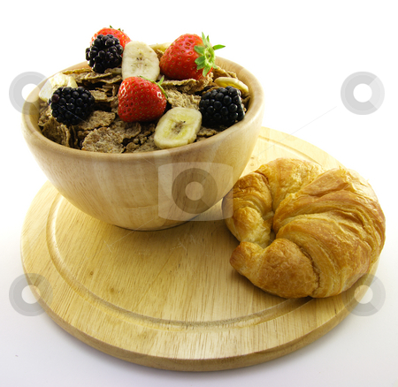 To use this stock image in your creative project, please select the size you need over to the right and click the "Add to Cart" button.
Your downloaded image will come with the Cutcaster watermark removed so don’t worry about the watermark you see on this page. Bran Flakes in a Wooden Bowl stock photo, Crunchy looking delicious bran flakes and juicy fruit in a wooden bowl with a croissant on a white background by Keith Wilson