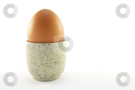 To use this stock image in your creative project, please select the size you need over to the right and click the "Add to Cart" button.
Your downloaded image will come with the Cutcaster watermark removed so don’t worry about the watermark you see on this page. Lightly Boiled Egg stock photo, Lightly boiled egg in a grey egg cup on a white background by Keith Wilson
