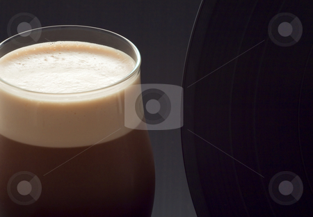 To use this stock image in your creative project, please select the size you need over to the right and click the "Add to Cart" button.
Your downloaded image will come with the Cutcaster watermark removed so don’t worry about the watermark you see on this page. Beer and music stock photo, Close up of a glass of irish stout with a vinyl record by Fabio Alcini