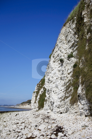 To use this stock image in your creative project, please select the size you need over to the right and click the "Add to Cart" button.
Your downloaded image will come with the Cutcaster watermark removed so don’t worry about the watermark you see on this page. Limestone sea cliffs stock photo, View of limestone sea cliffs under a warm blue summer sky by Mike Smith