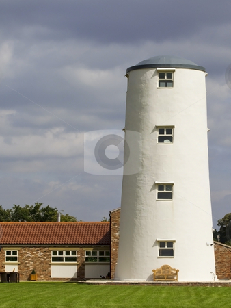 To use this stock image in your creative project, please select the size you need over to the right and click the "Add to Cart" button.
Your downloaded image will come with the Cutcaster watermark removed so don’t worry about the watermark you see on this page. Converted windmill stock photo, An old windmill converted for accomodation by Mike Smith