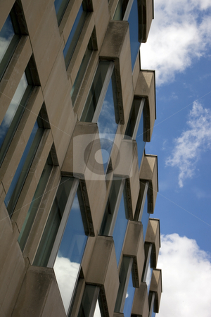 To use this stock image in your creative project, please select the size you need over to the right and click the "Add to Cart" button.
Your downloaded image will come with the Cutcaster watermark removed so don’t worry about the watermark you see on this page. Reflections on contemporary architecture 2 stock photo, Reflections of summer sky in windows of a modern city building by Mike Smith